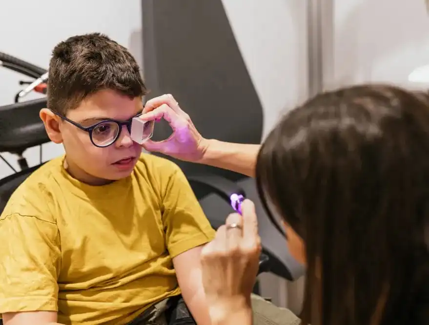 the picture is showing CP child is helped by a health care provider 